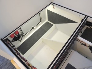 Carpeted exposed surfaces in underbed cargo area