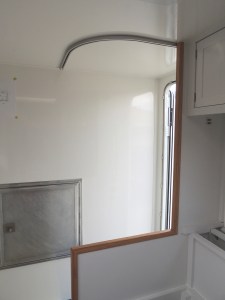 Cut, fit, and installed shower curtain track over shower