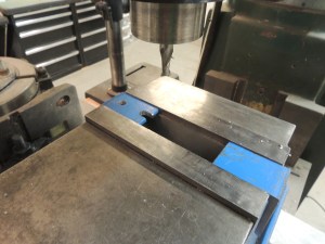 Fabricated under subframe storage box lock plates