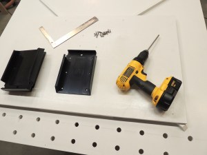 Mounted overhead storage bins to underside of drive side bed deck