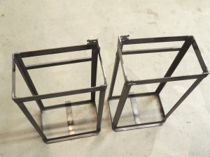 Welded lock plates to under subframe storage box mounts