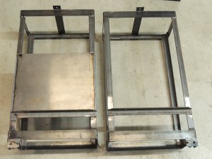 Welded steel heater exhaust heat shield to driver side under subframe storage box mount