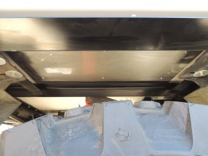 Bonded on stainless steel over tire rock shields