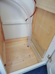 Drilled 1 inch hole for under sink drain and installed drain hose