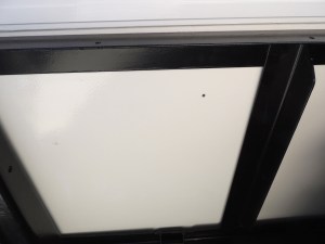 Drilled pilot hole for under sink drain