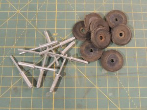 Enlarged rivet holes for jerry can bumpers on under subframe storage box mount