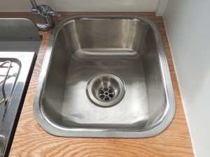 Installed sink drain and connected to drain hose