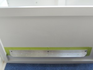 Prepped, masked, and bond installed dinette foot rest