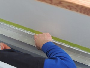 Prepped, masked, and bond installed dinette foot rest