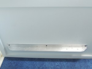 Prepped, masked, and bond installed dinette foot rest