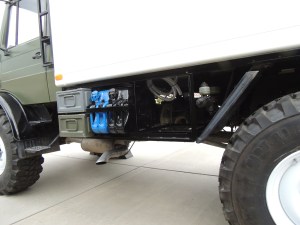 Installed driver side under subframe mount, storage boxes, Jerry cans, and gray water tank