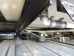 Installed shower drain plumbing assembly