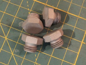 Machined and welded portal tank dipstick pins