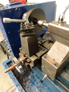 Machined new Delrin bezel for fitting new speedometer in old dash panel hole