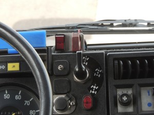Modified and improved engine pre-heater switch mounting in truck cab