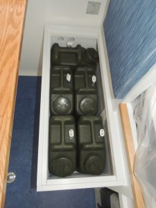 Stowed water Jerry cans in habitat